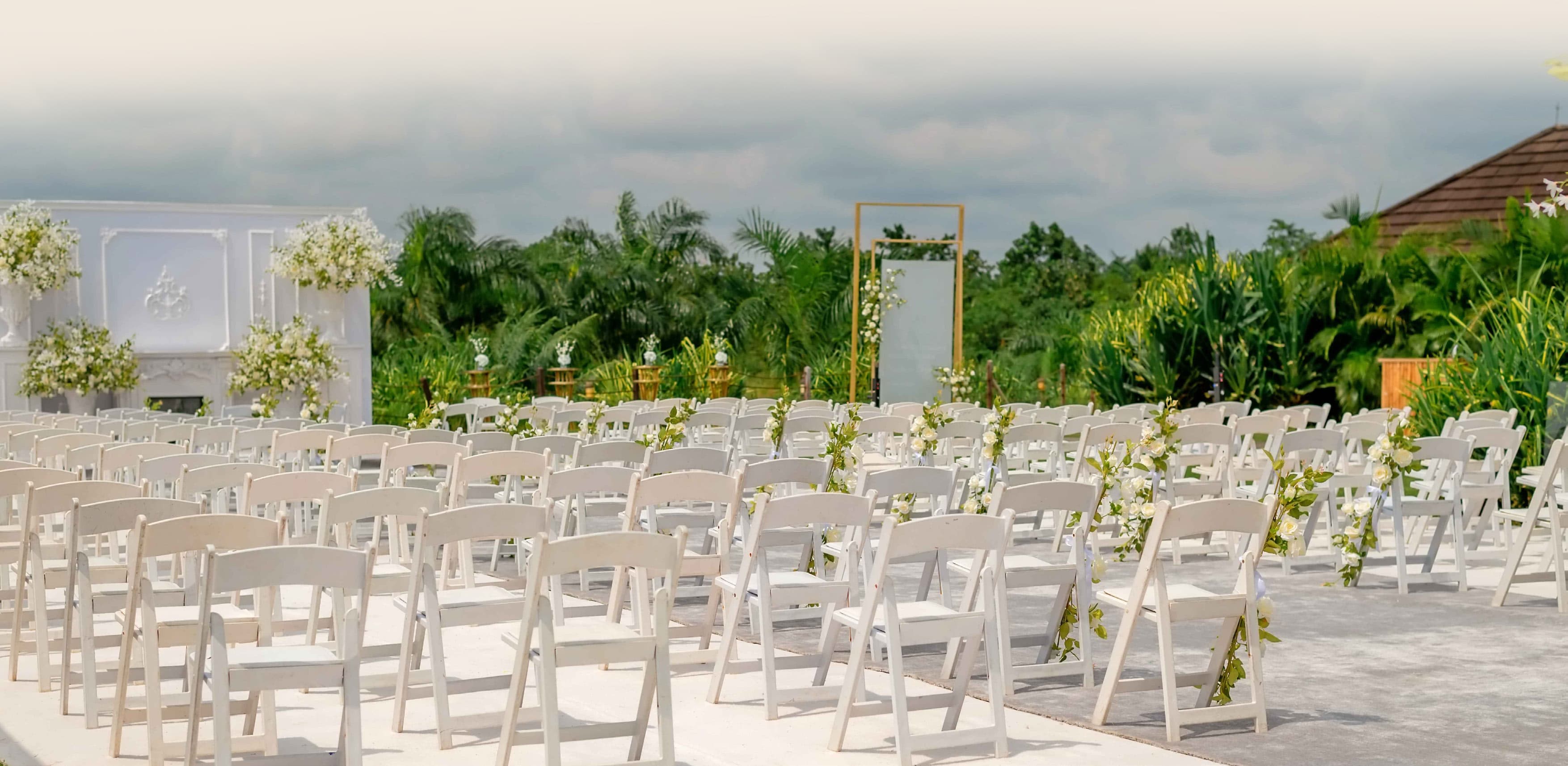 Outdoor wedding ceremony setup at Lakowe Lakes